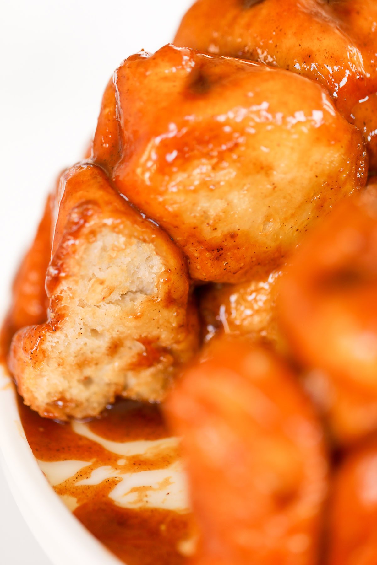 Close-up of monkey bread. One bite reveals the inside texture.