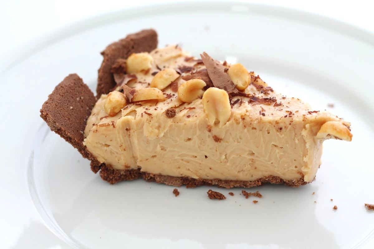 slice of easy no bake peanut butter cheesecake on white plate