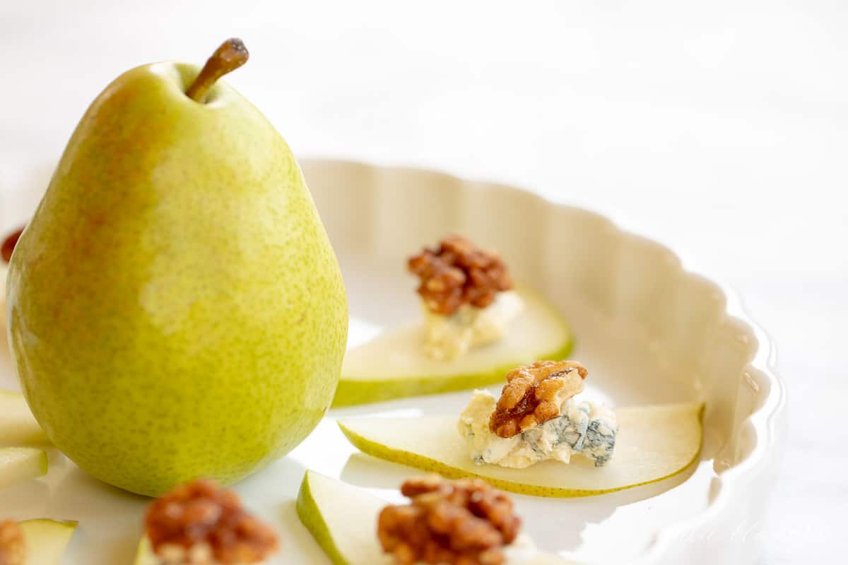 pear in center of platter with pear wedges surrounding it