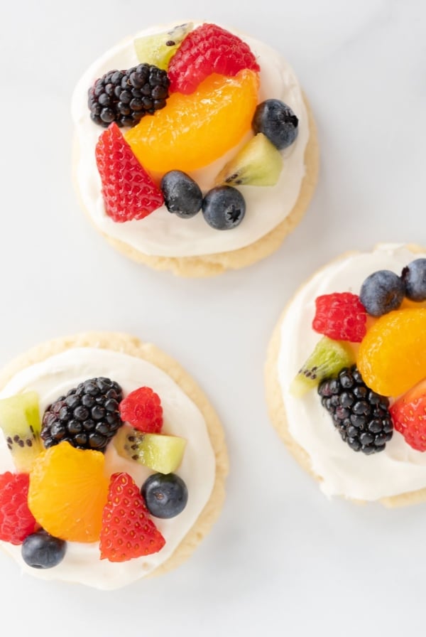 Fruit pizza cookies on a marble surface