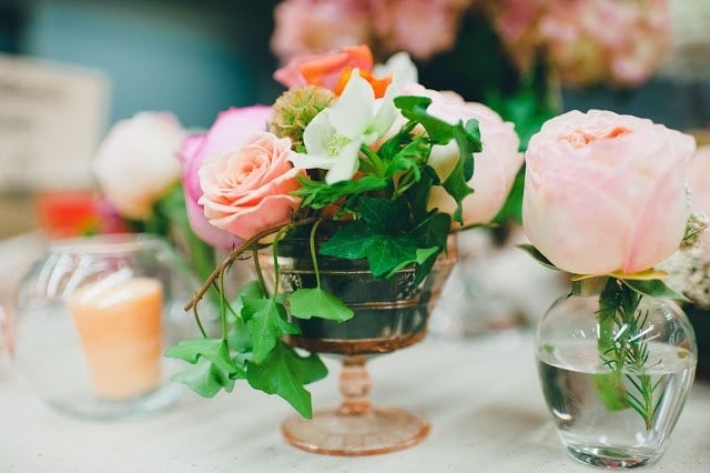 A close up of a pink, orange, green, and purple flowers 