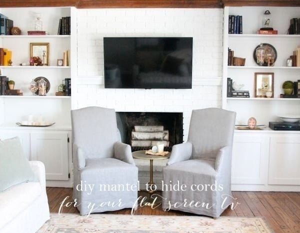 A living room filled with furniture and a flat screen TV mounted on the wall
