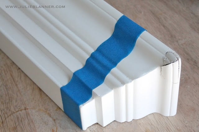 A close up of a white wall mount shelf