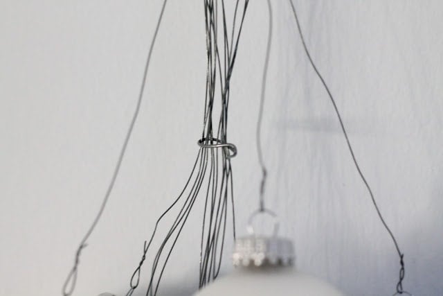 Blue, silver, and baseball ornaments hanging on the wall.