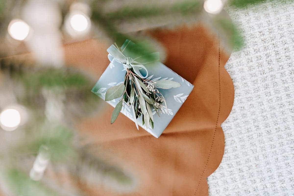 small present under tree on leather tree skirt