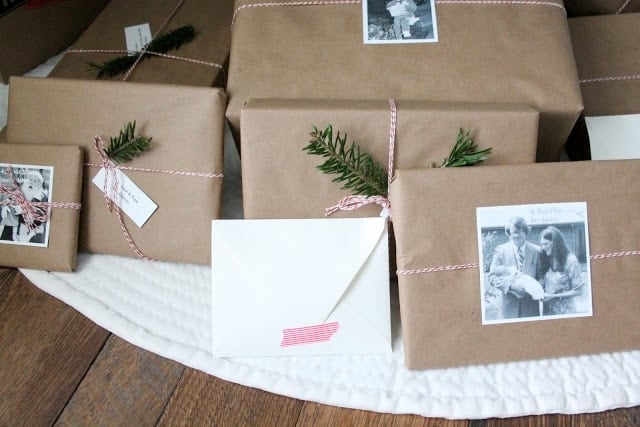 kraft paper christmas paper wrapping tied with baker's twine and decorated with old family photos.