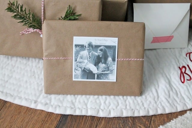 kraft paper christmas paper wrapping tied with baker's twine and decorated with old family photos.