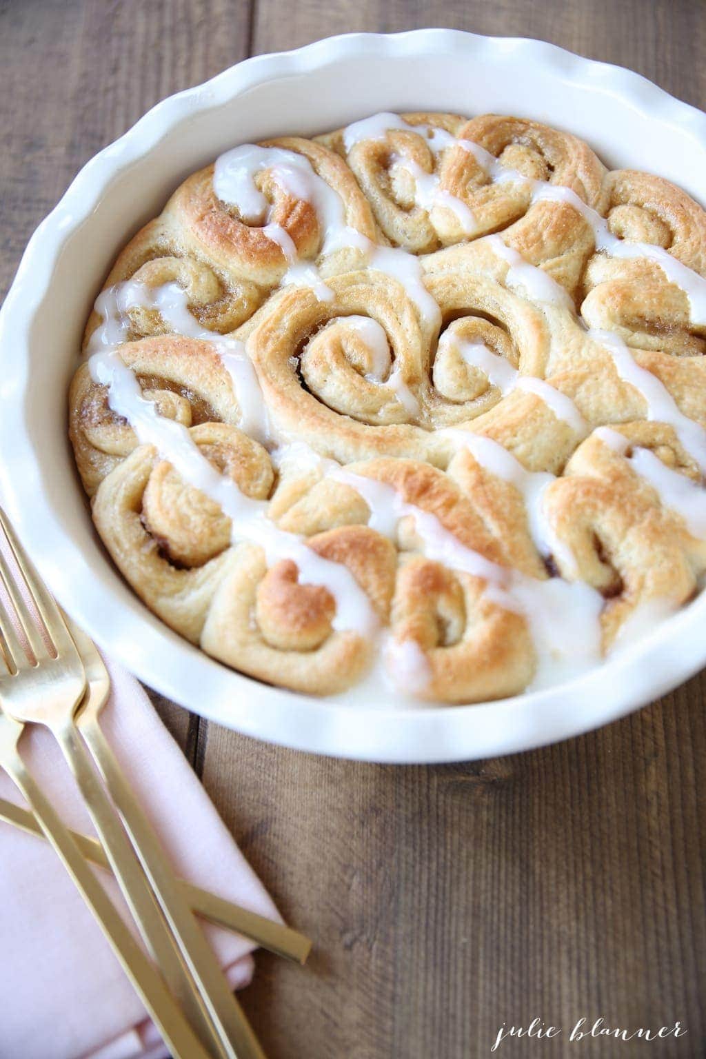 Baked heart shaped rolls drizzled with icing