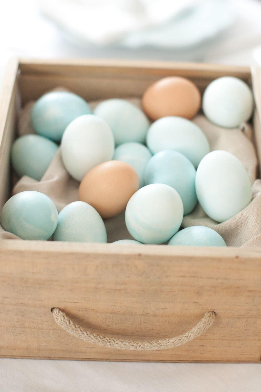 A basket of multicolored eggs.