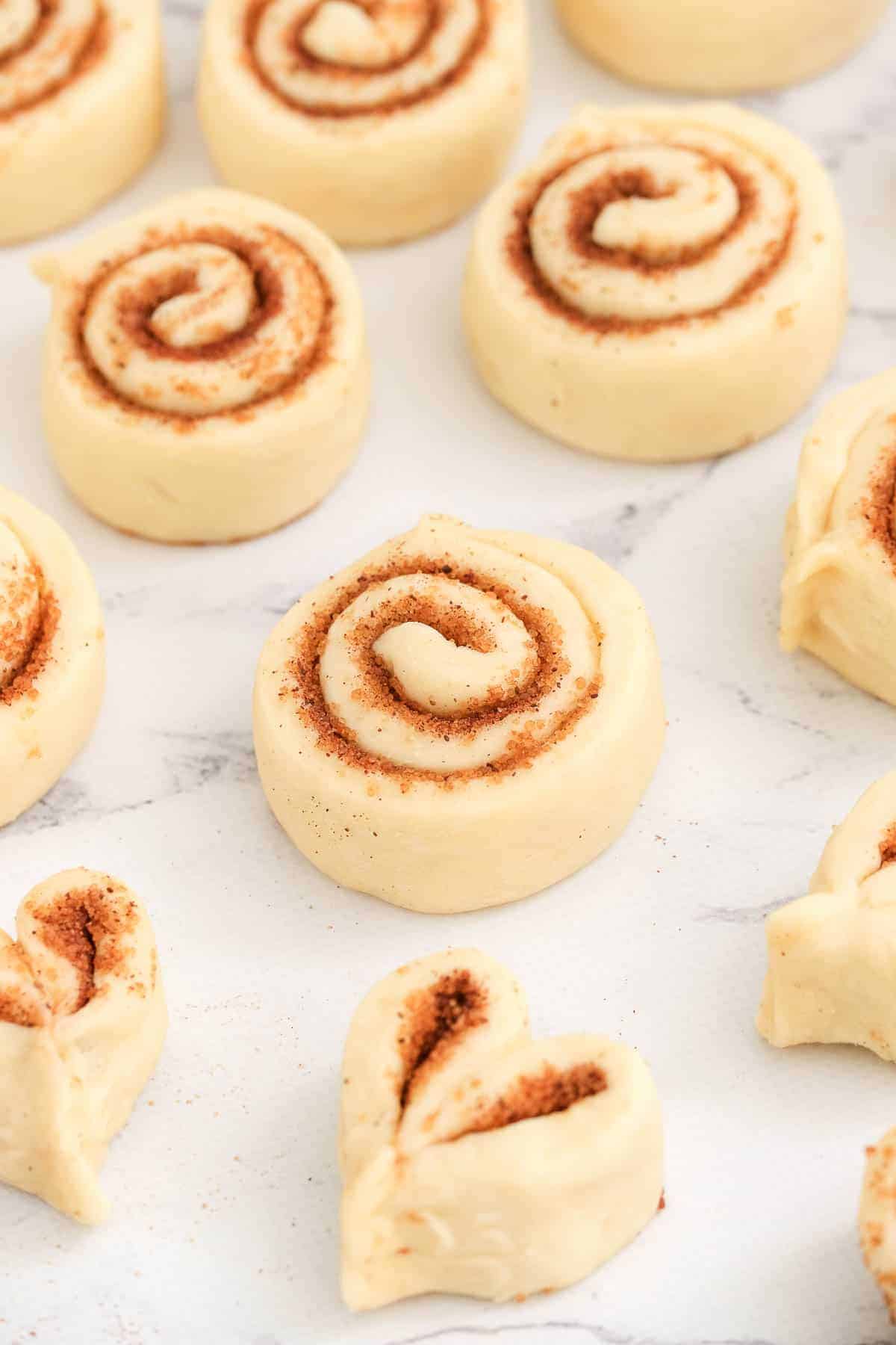 cinnamon rolls and bunny ears formed out of dough