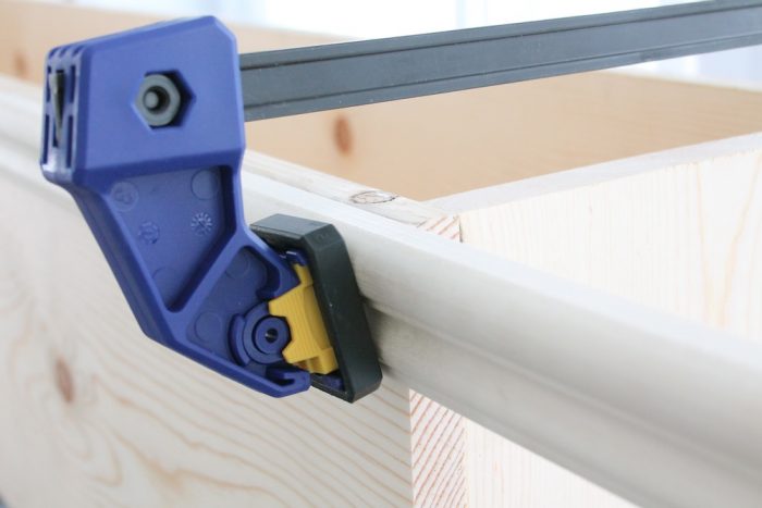 A wooden window box in the process of being made.