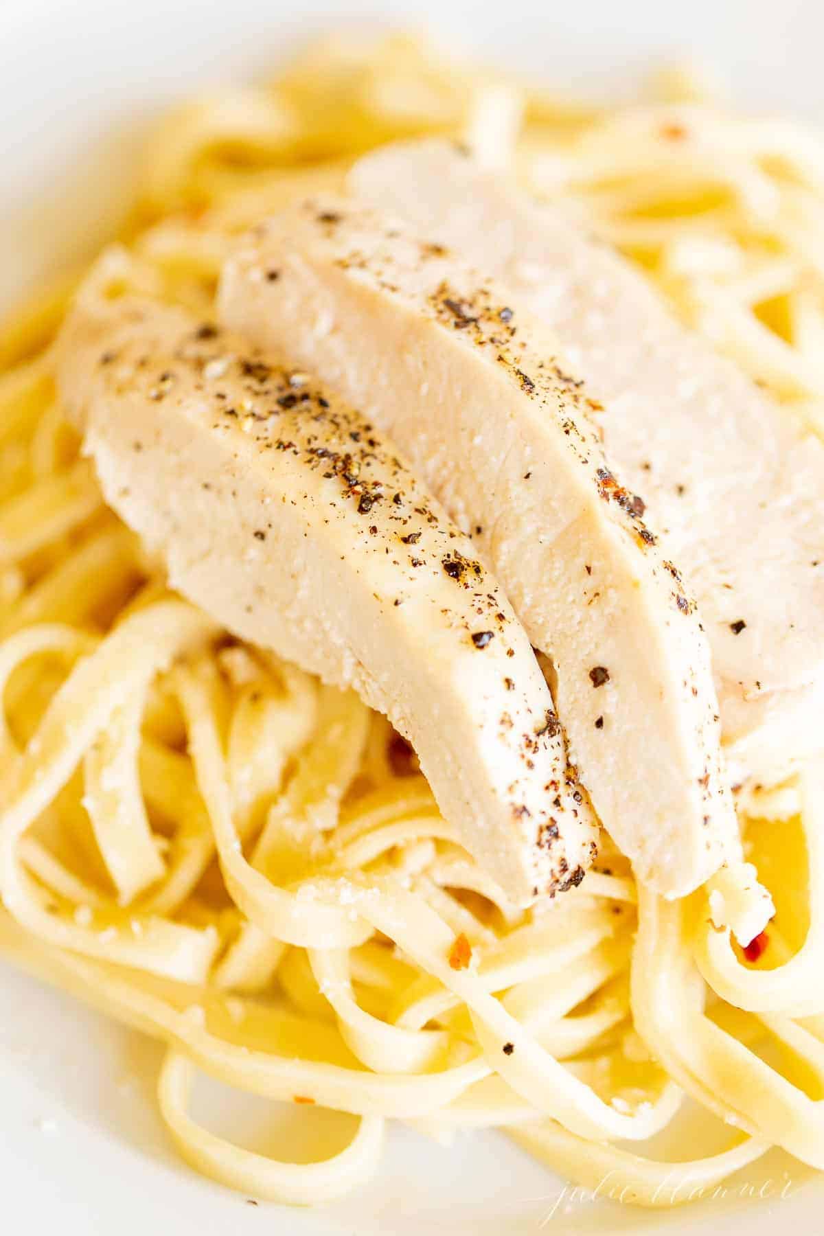 chicken on bed of pasta 