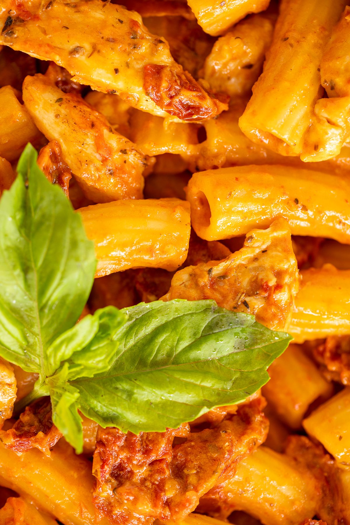 Sun dried tomato chicken pasta in a cast iron skillet.