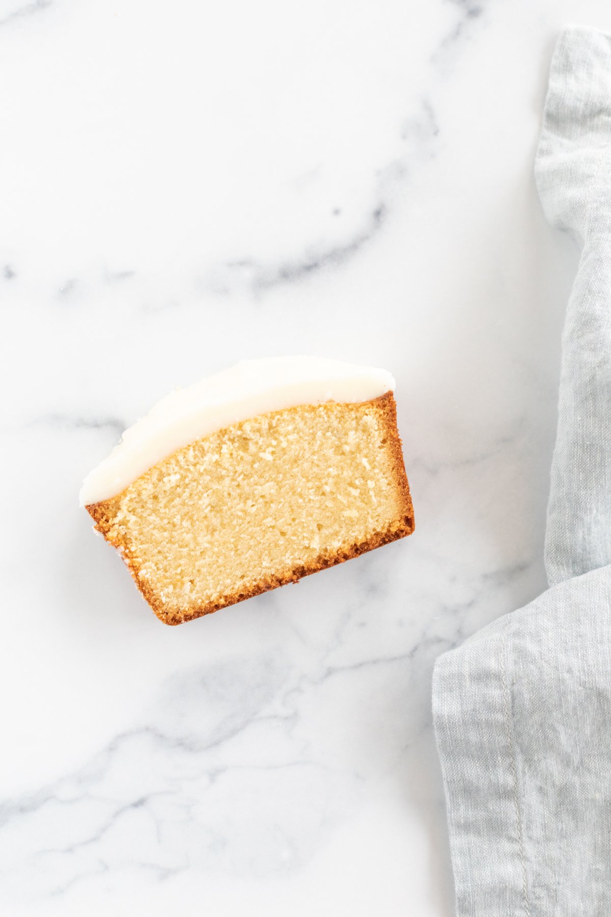 Pound cake slice covered in a pound cake glaze.