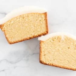 Two slices of pound cake covered in an easy pound cake glaze recipe.