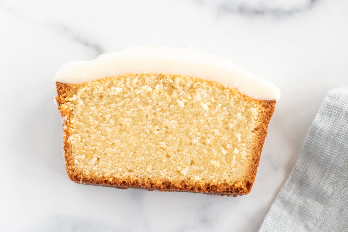 Pound cake slice covered in a pound cake glaze.