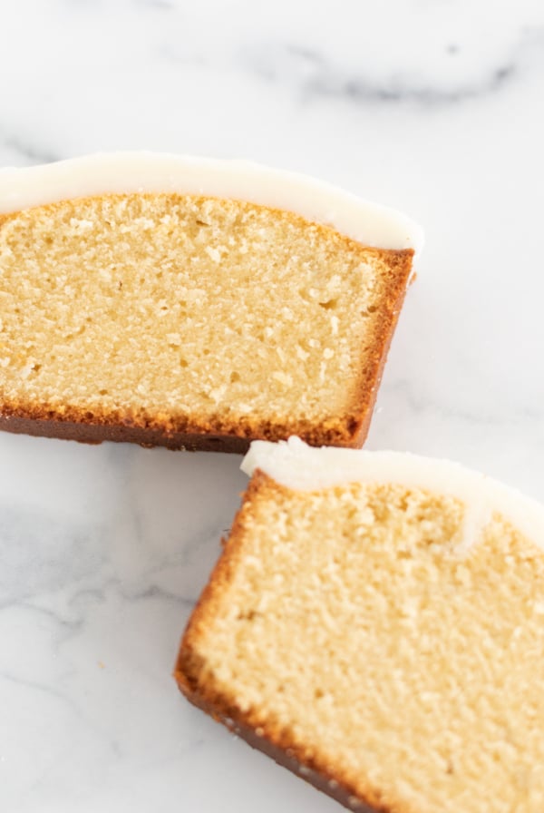 Two slices of pound cake covered in an easy pound cake glaze recipe.