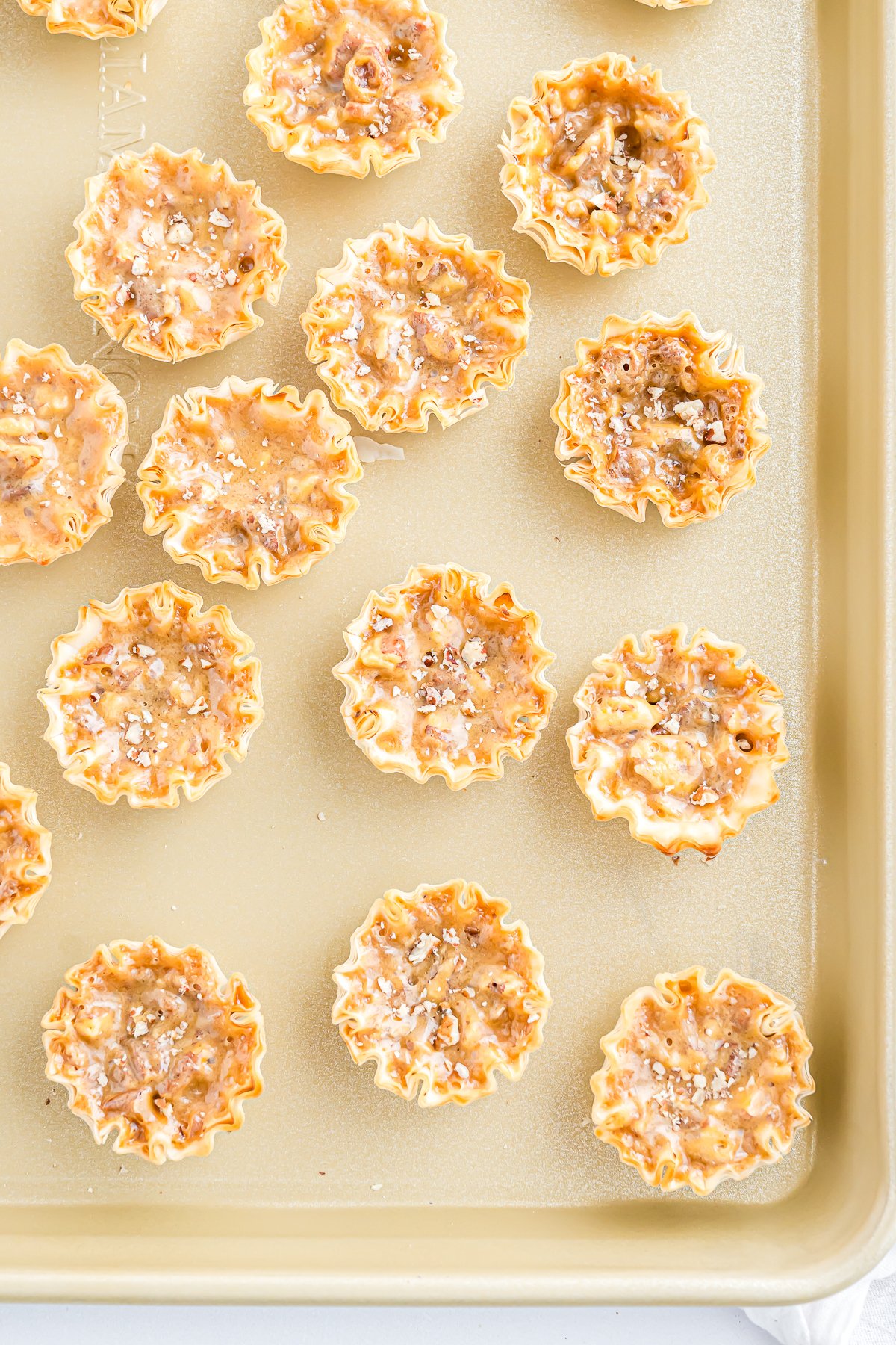 A baking sheet with a tray of Mini Pecan Pie on it.