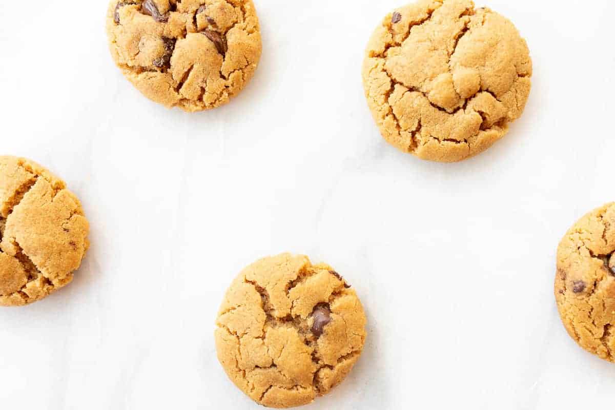 flourless peanut butter chocolate chip cookies on marble counter