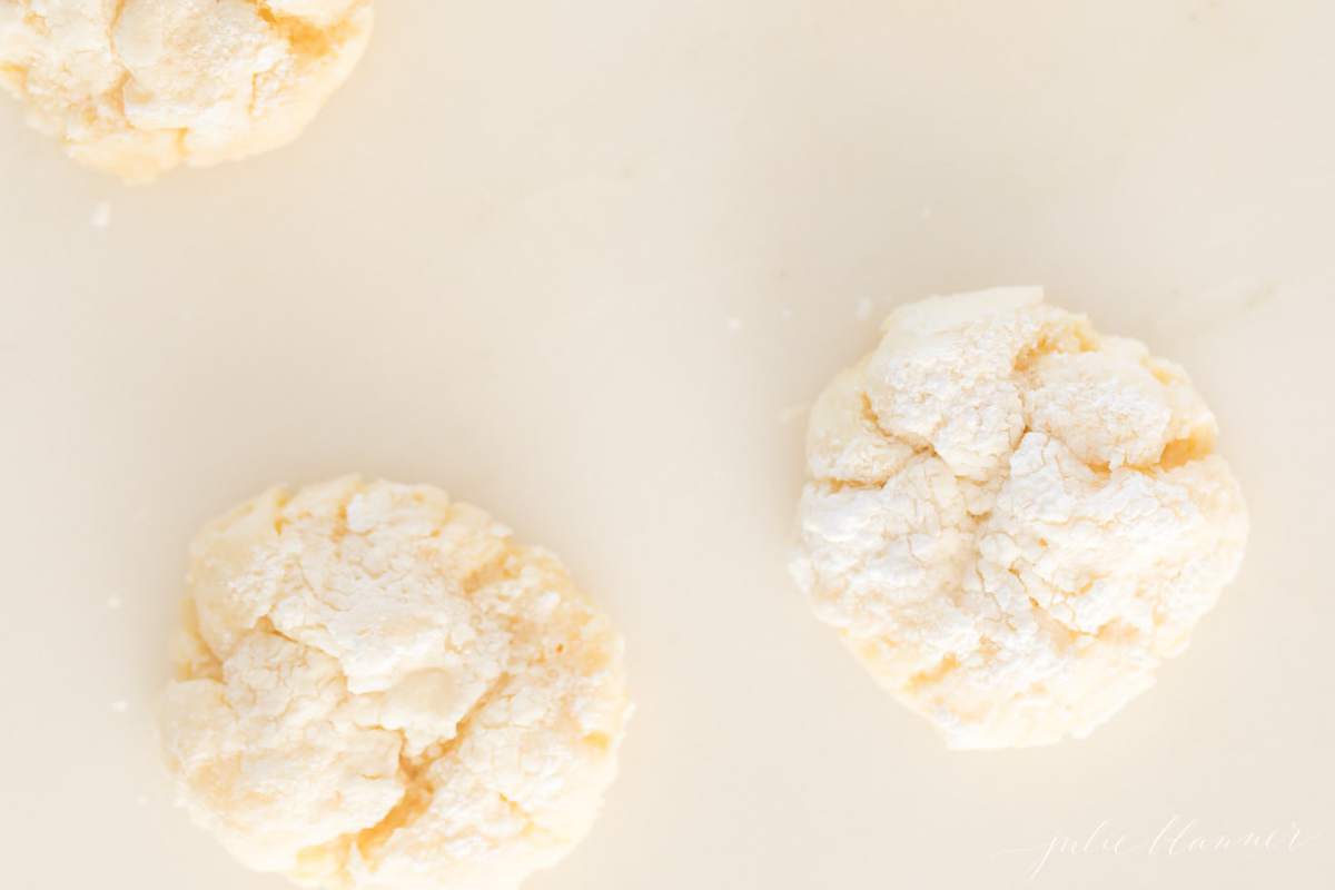 Three gooey butter cookies on a white surface