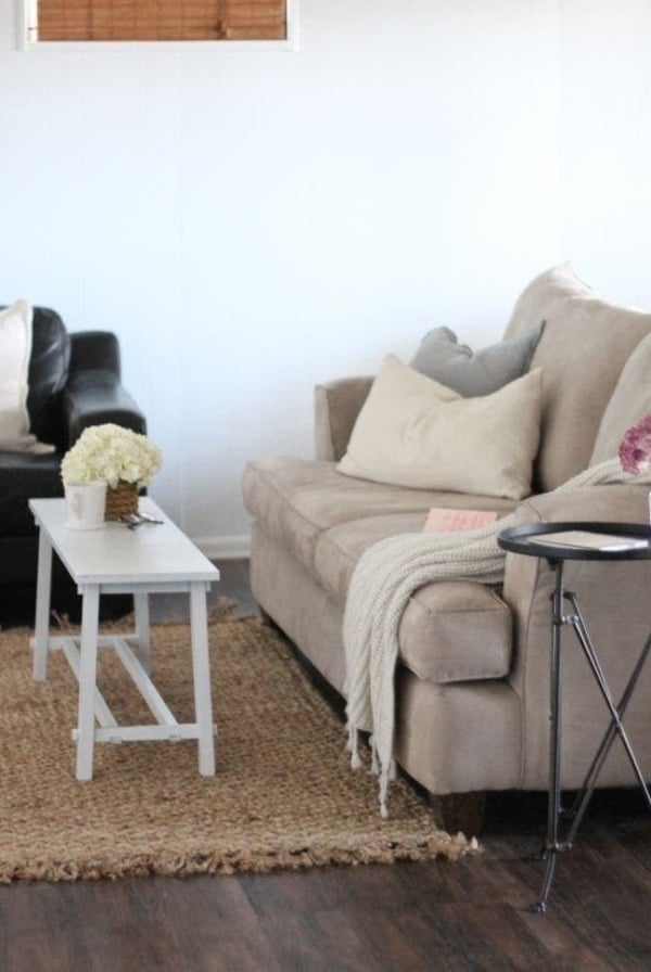 You'll never believe this finished basement remodel / update! Great tips for adding light & new floors on a budget