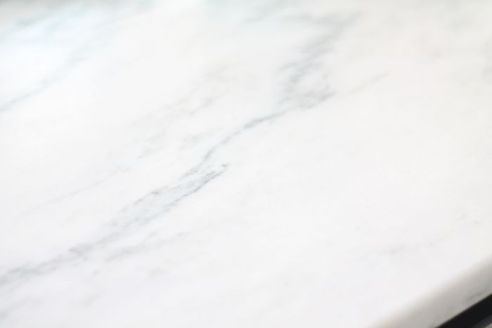 A close up of a marble countertop used in a kitchen makeover on a budget.