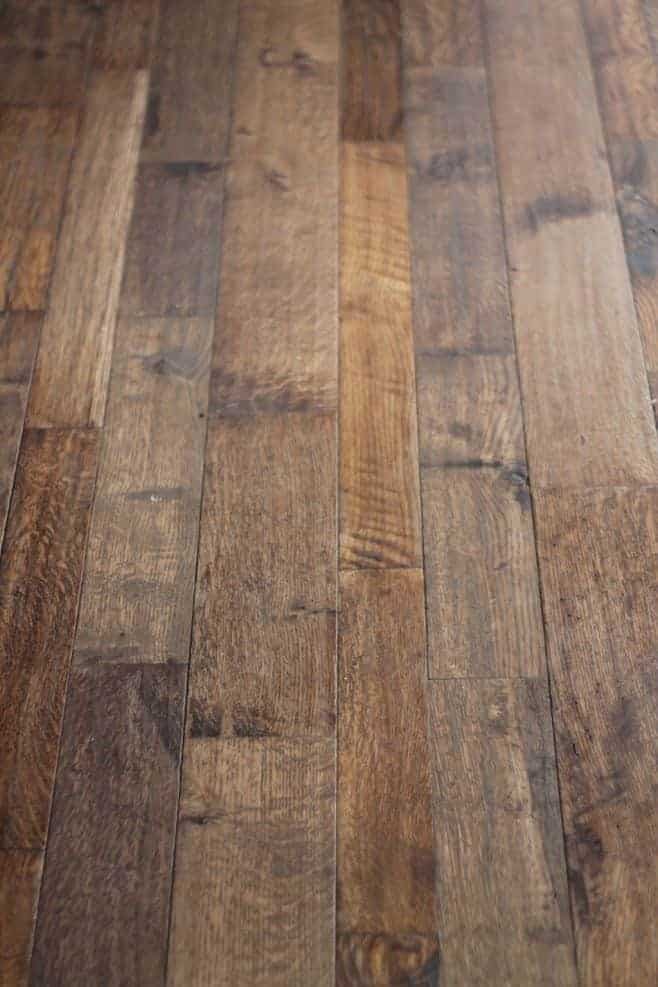 A rustic wood floor in farmhouse kitchen ideas on a budget.