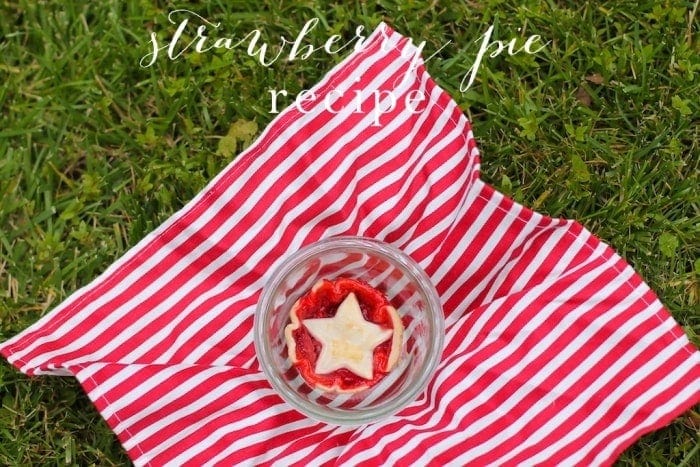 A strawberry pie in a glass bowl with text overlay