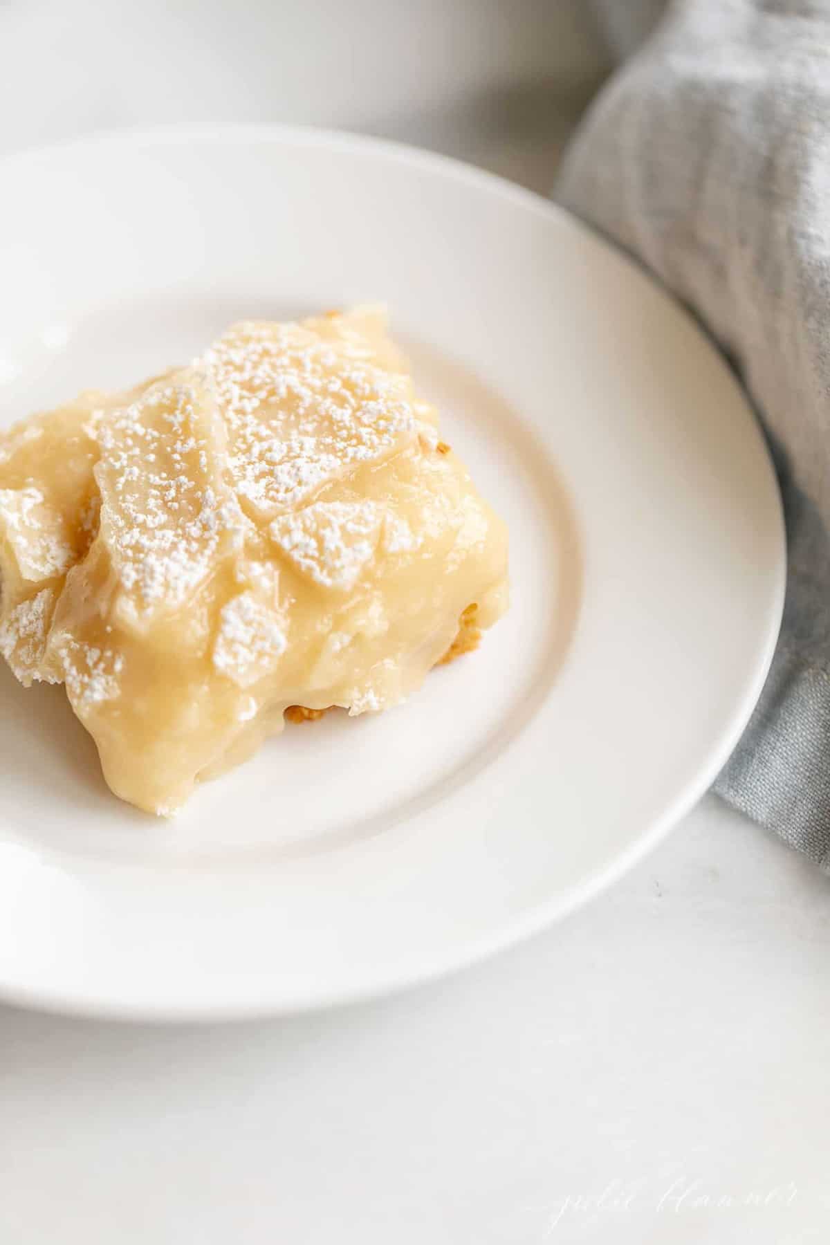 gooey butter cake slice on a white plate