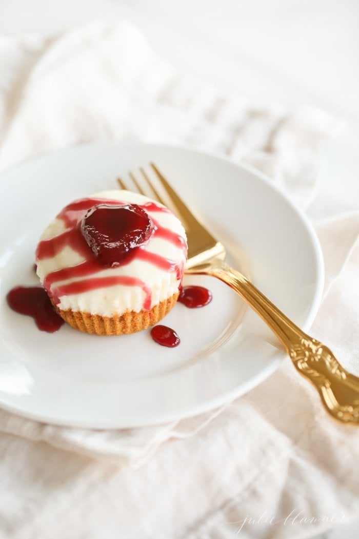 A no bake cheesecake drizzled with red sauce