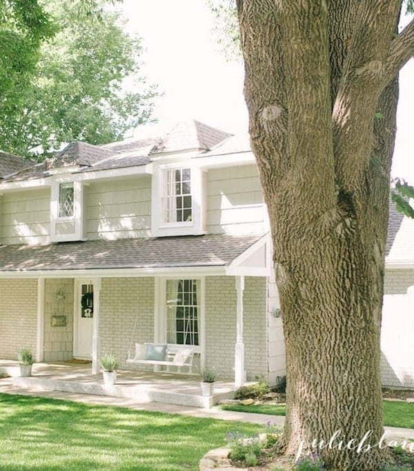 Greige painted brick on traditional Colonial home