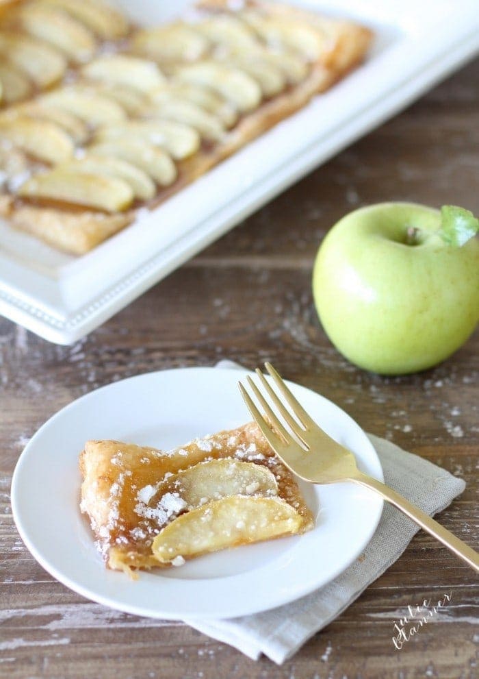 Baked apple tart sprinkled with powdered sugar