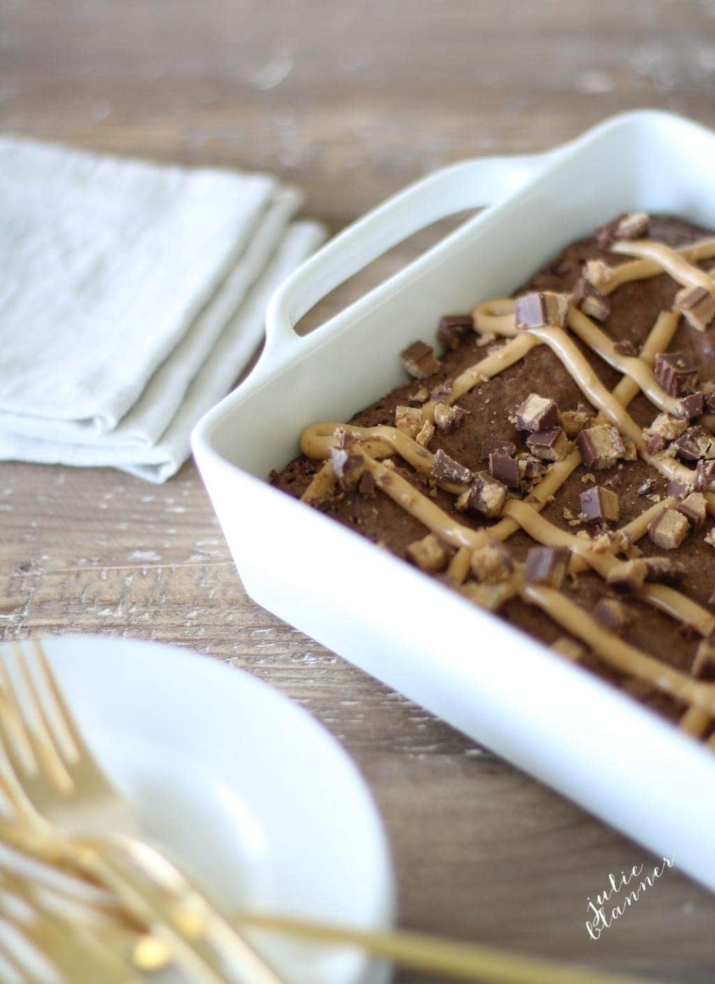 The uncut brownie ready to serve in a baking dish