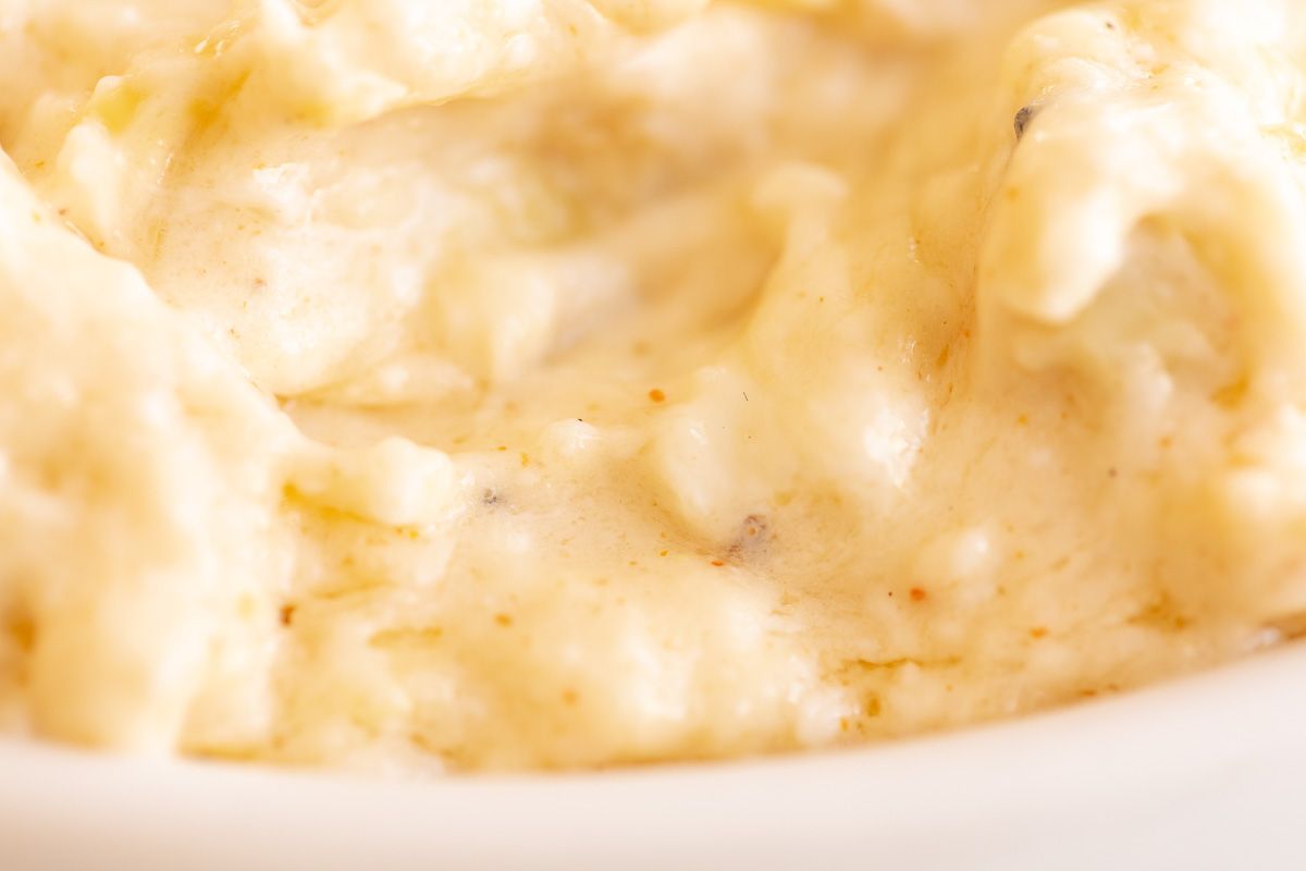 Close up of a baked artichoke dip