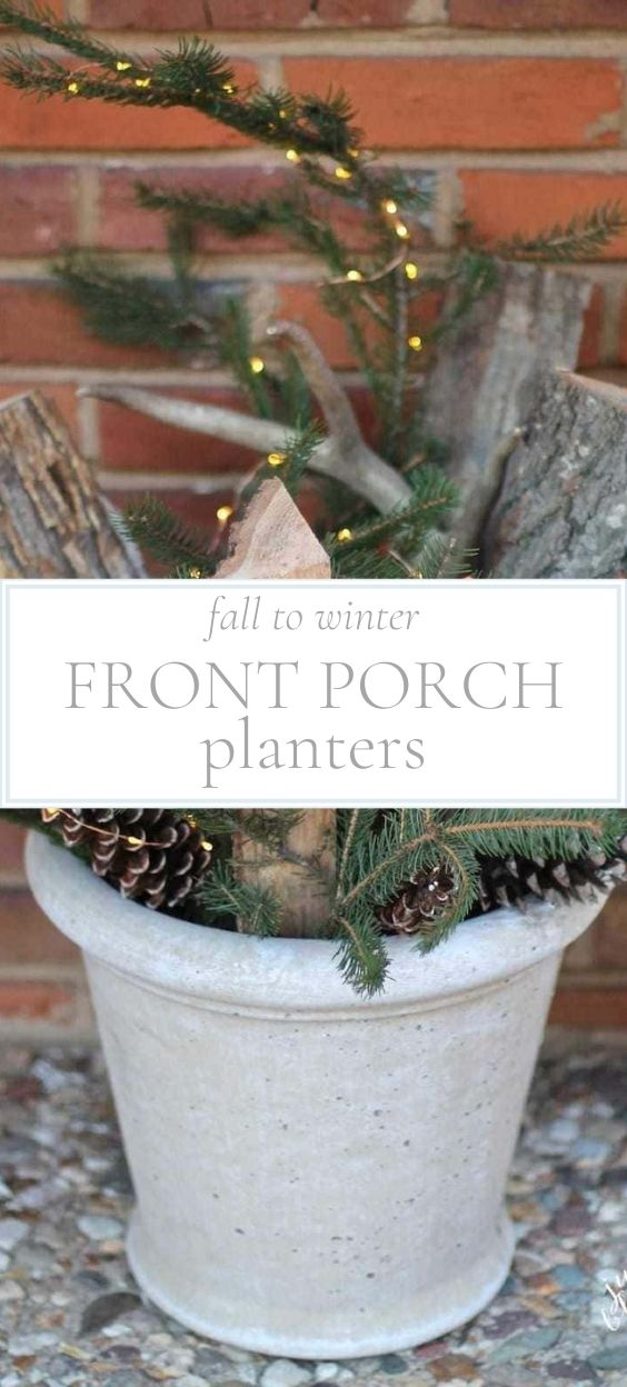 A white bucket containing firewood logs and greenery and small fairy lights.