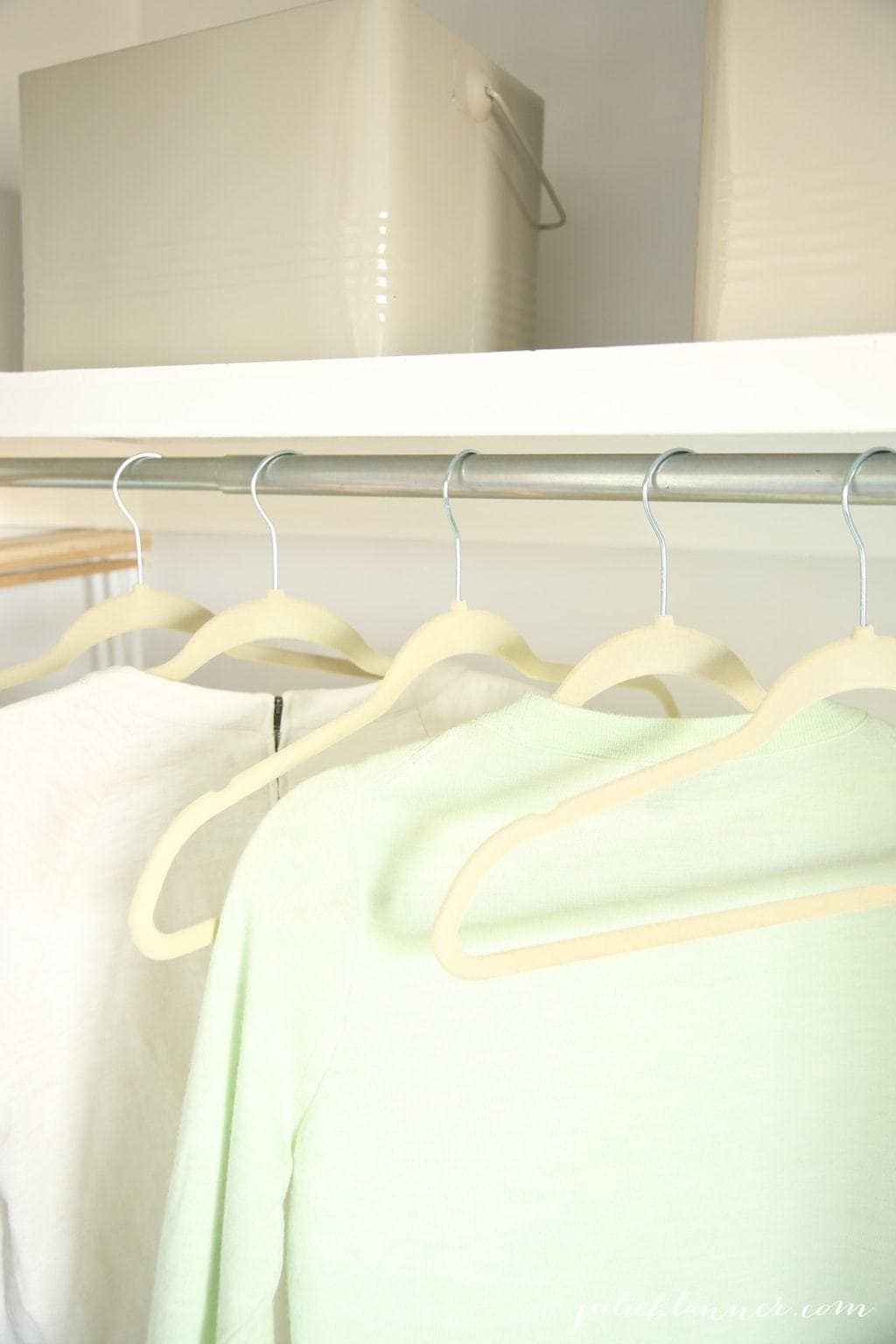 clothes hanging in closet