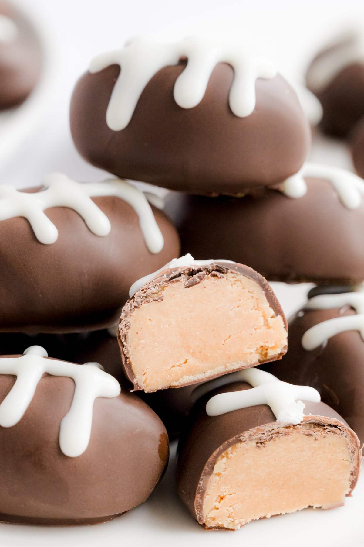 A pile of peanut butter truffles on a plate.