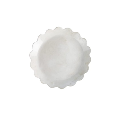 A scalloped white tray