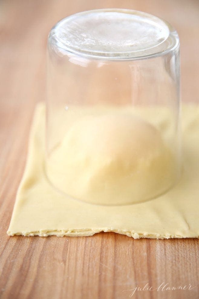 Cutting out the ravioli with a glass