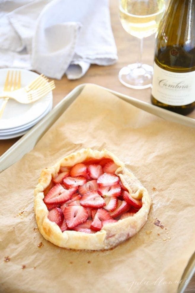The baked strawberry tart on a baking sheet