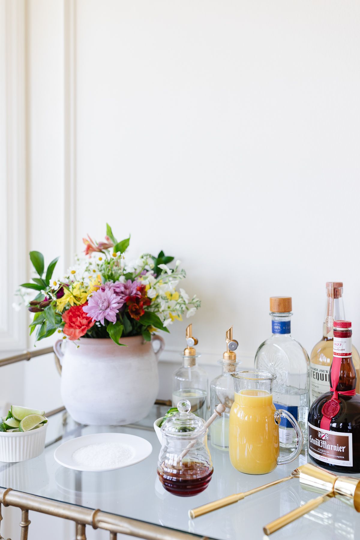 A margarita bar on a gold bar cart