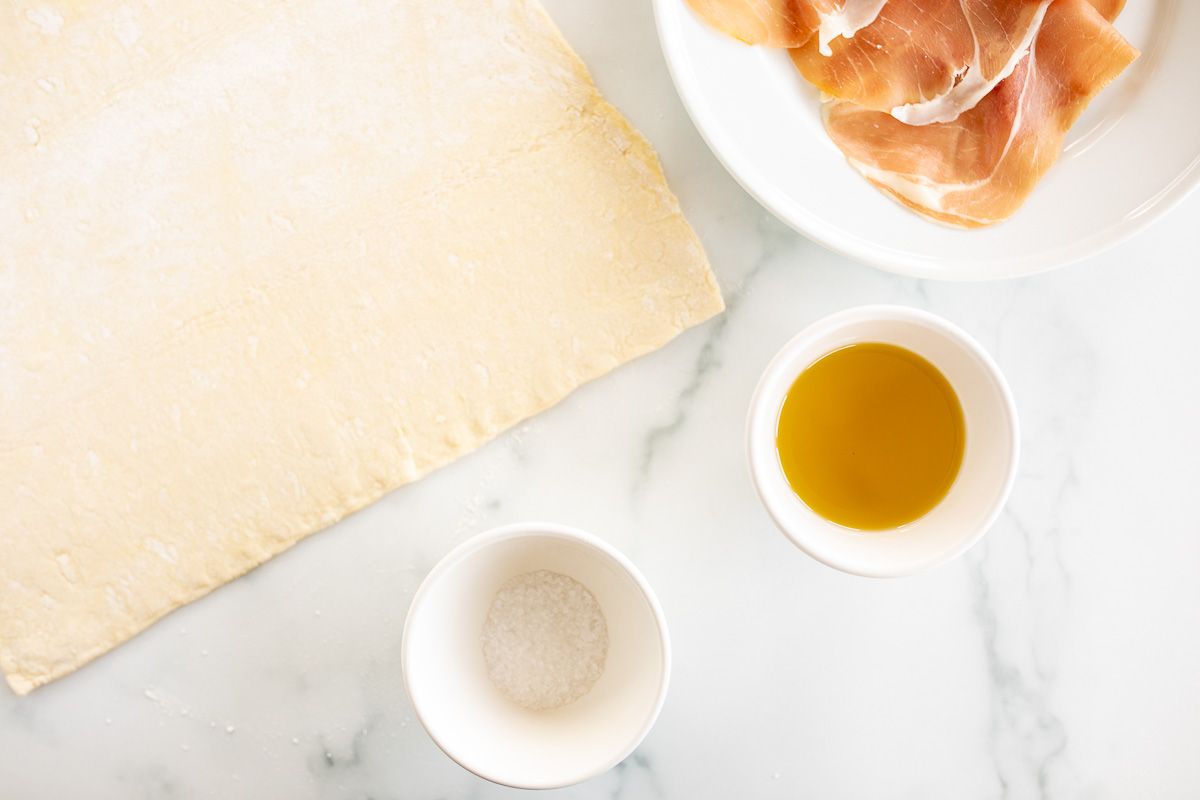 Ingredients for gnocco fritto laid out on a marble surface