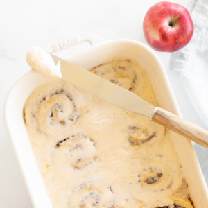 Apple cinnamon rolls in a baking dish.