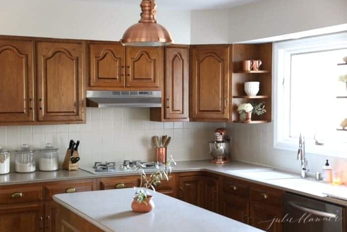 An oak kitchen updated with paint colors that go with oak cabinets.