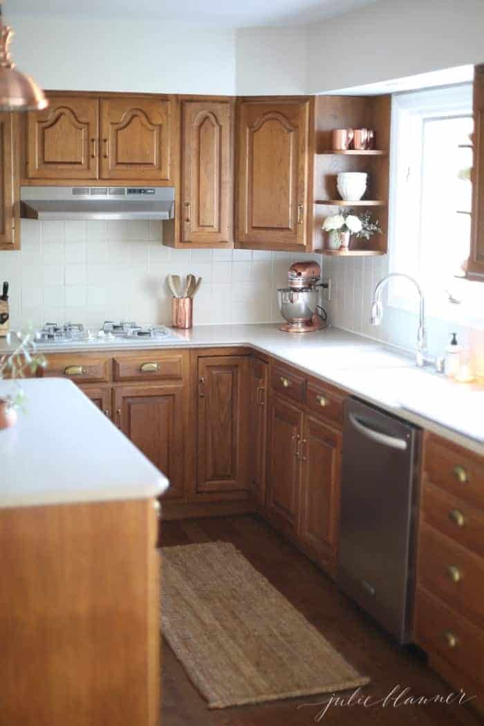 An oak kitchen updated with paint colors that go with oak cabinets.