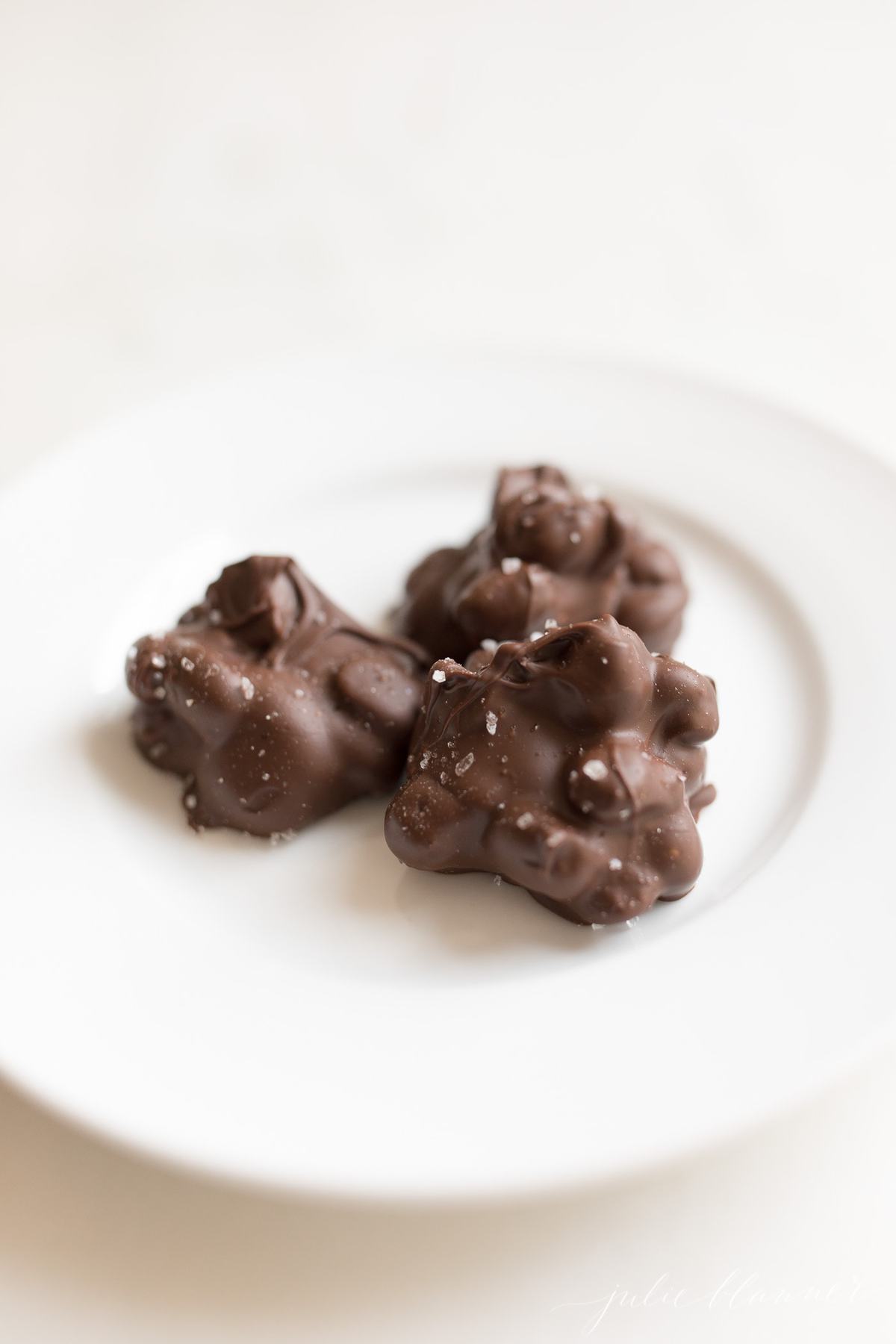peanut clusters with sea salt on a plate