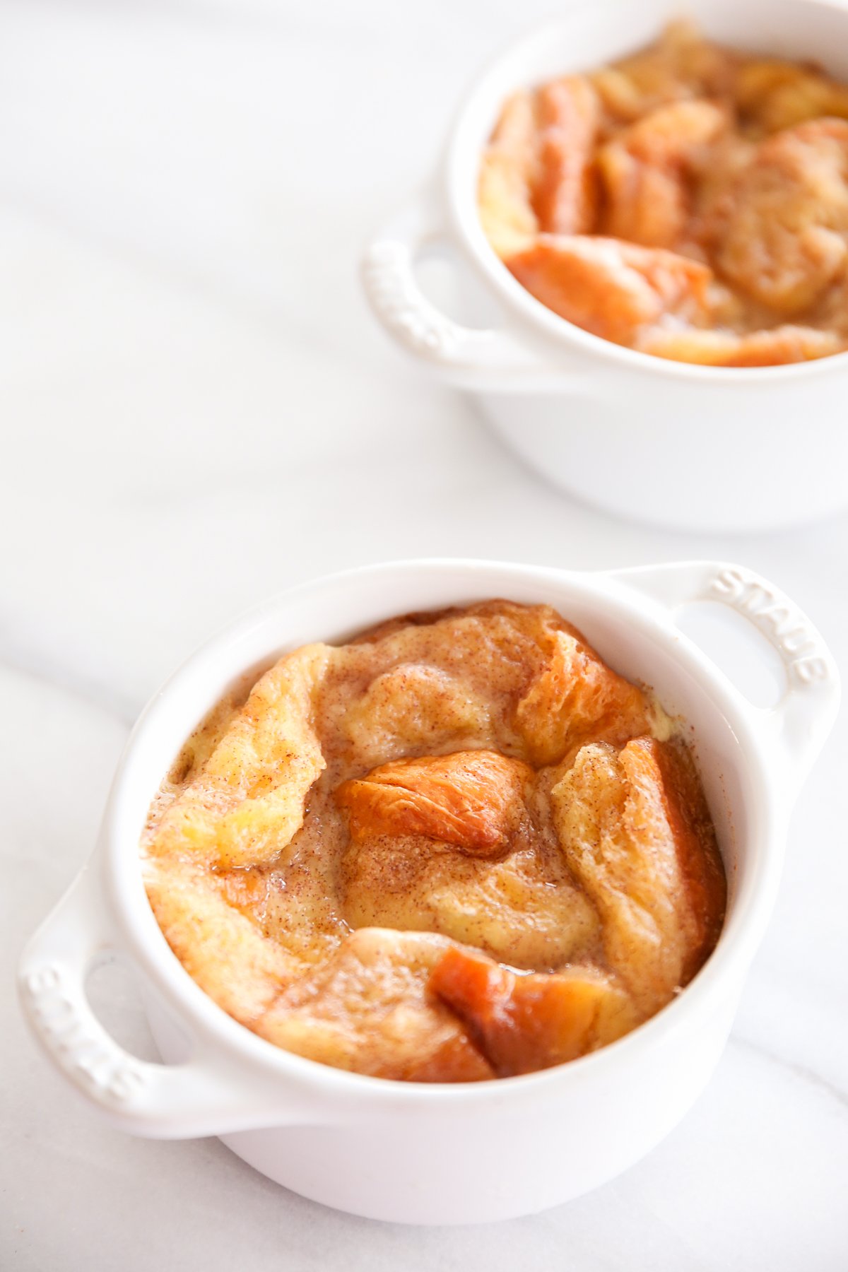 bread pudding in an individual, white baking dish