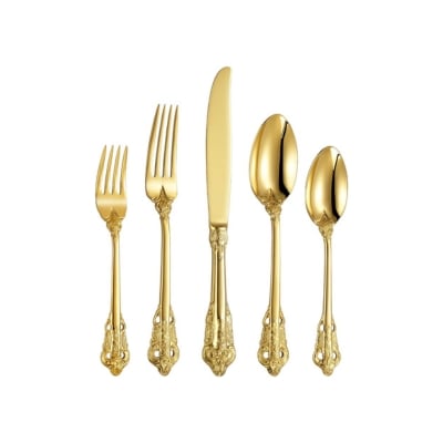 A set of gold forks and spoons arranged elegantly on a white background, perfect for a Christmas candle centerpiece.