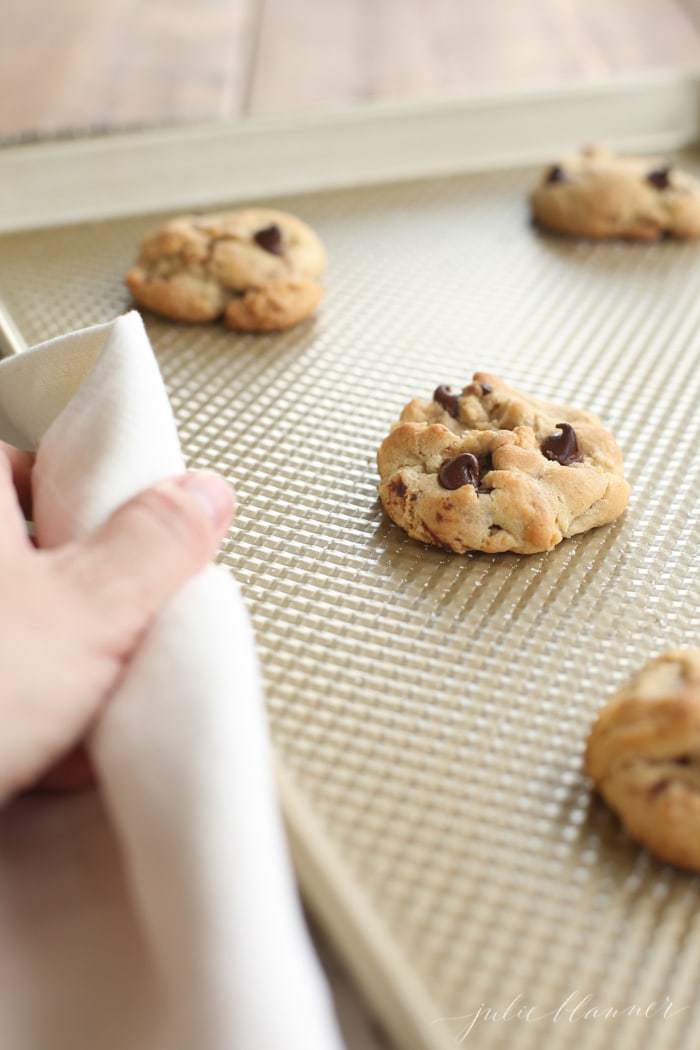 Baked chocolate chip cookies on a baking tray