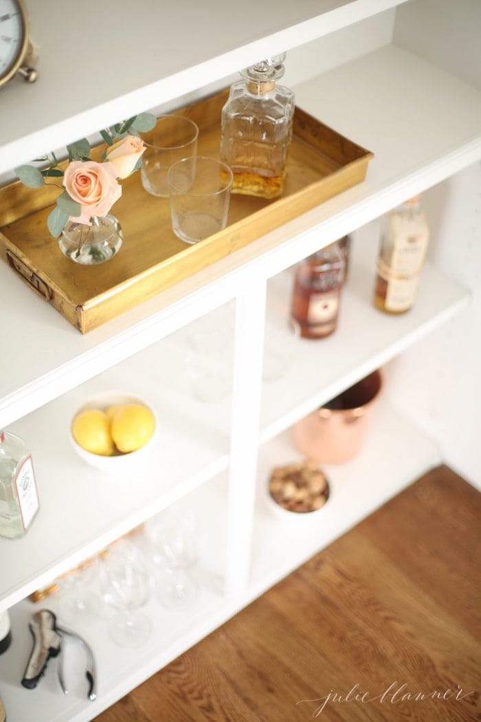 Entertaining blogger Lifestyle Gleam converted her built in bookcases into a beautiful bar cabinet